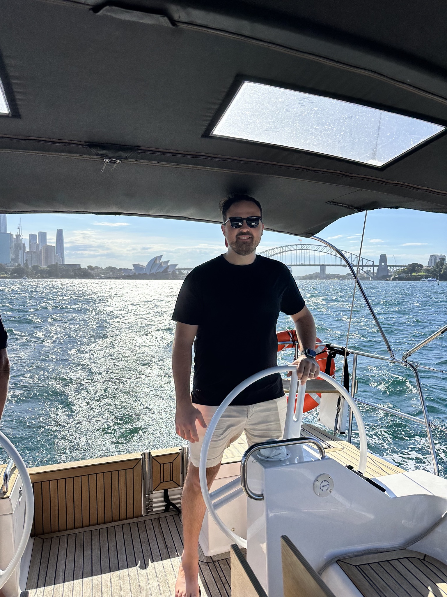 Captain at the helm of a yacht